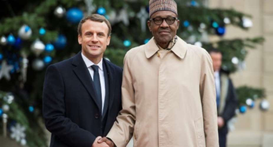 Macron met Buhari at the Elysee palace in  December.  By CHRISTOPHE ARCHAMBAULT (AFP/File)