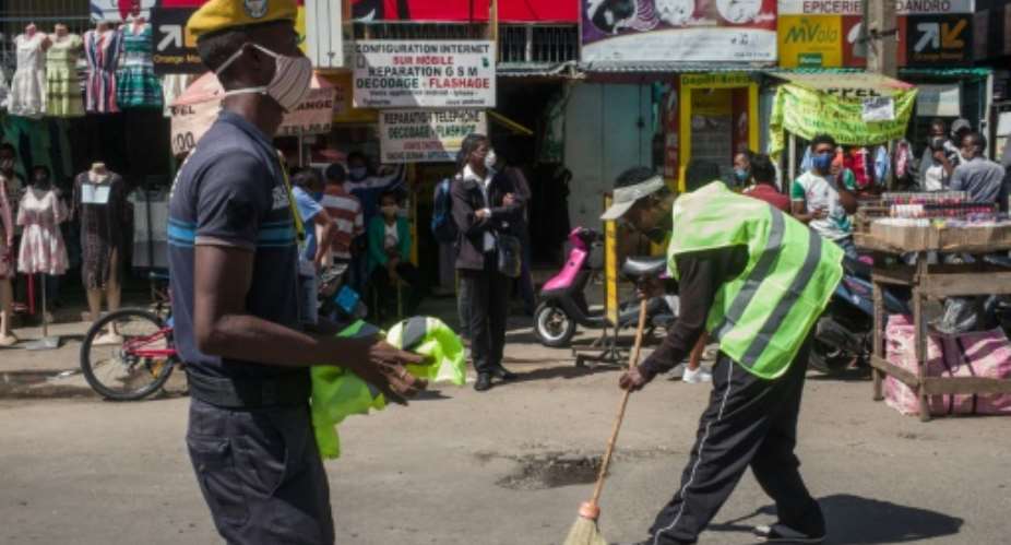 Madagascar has ruled that people caught not wearing a face mask outside will be forced to sweep the streets.  By RIJASOLO AFP
