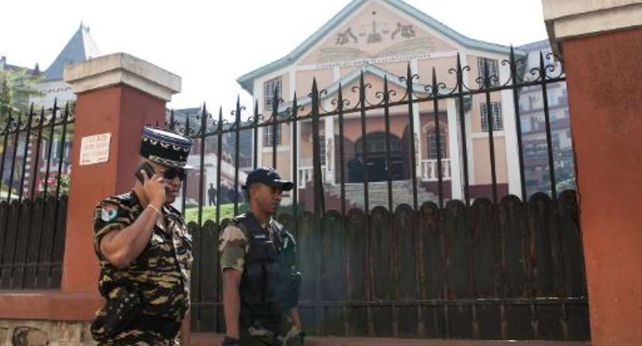 Police oversee the security measures around the Constitutional High Court on June 10, 2015 in Antananarivo.  By Rijasolo AFPFile