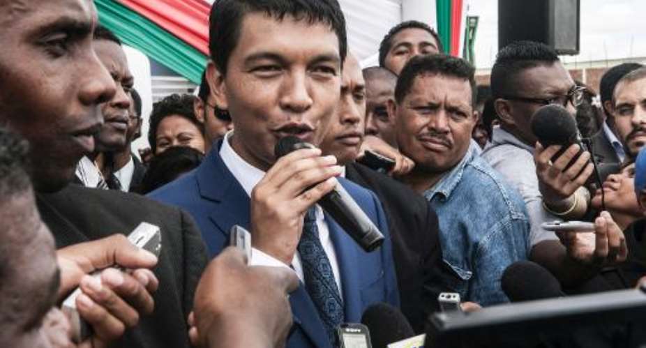 Andry Rajoelina C, the transitional President of Madagascar, speaks about his political future as he addresses journalists during the inauguration of a hospital in Antananarivo on January 22, 2014.  By Rijasolo AFPFile
