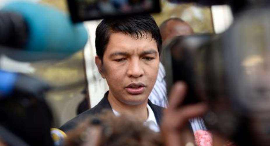 Madagascan strongman Andry Rajoelina speaks to the press on October 25, 2013 after voting in the presidential elections at a polling station in Antananarivo.  By Stephane de Sakutin (AFP/File)