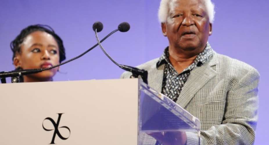 Magubane became the official photographer of Nelson Mandela when he was released from prison in 1990.  By Stephen Lovekin (GETTY IMAGES NORTH AMERICA/AFP)