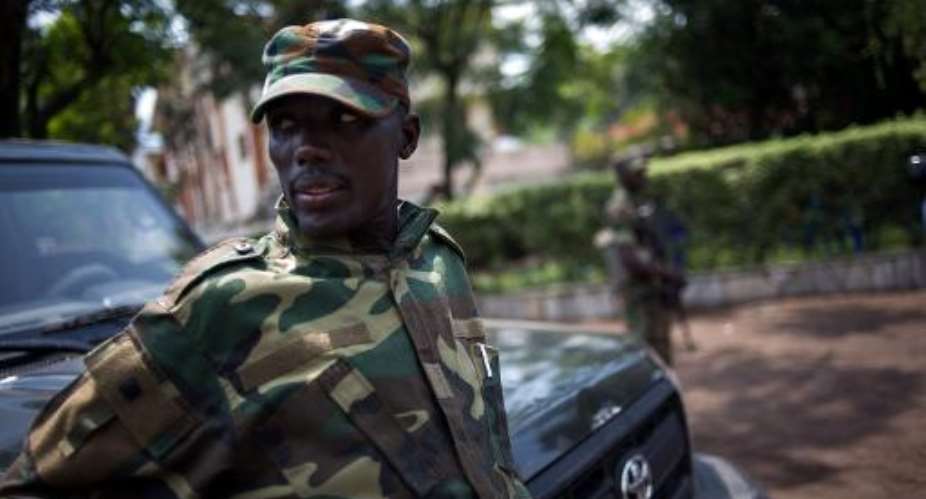 The head of the M23 rebel military forces, Brigadier-General Sultani Makenga, leans on a car on November 25, 2012 on the grounds of a military residence in Goma.  By Phil Moore AFPFile