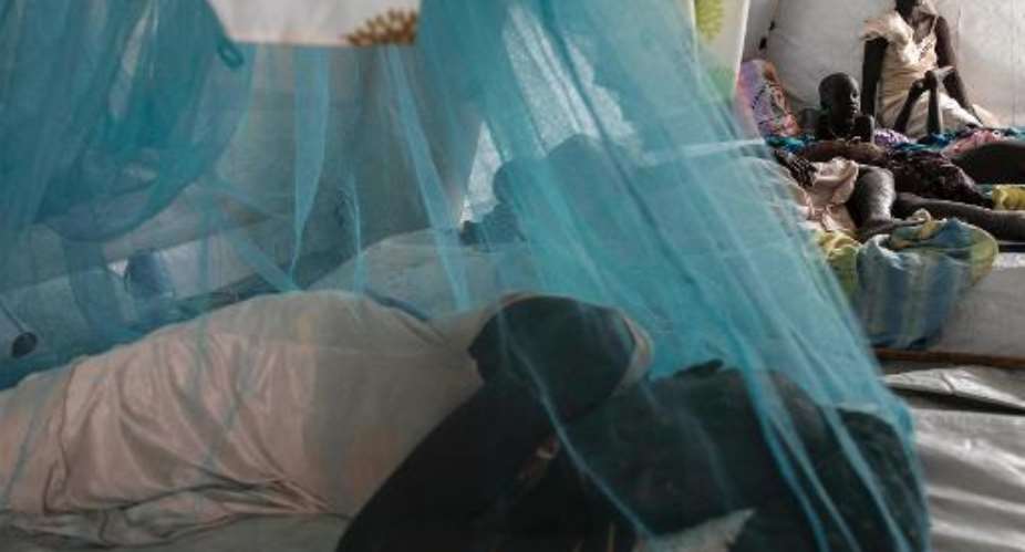 Patients suffering from Malaria rest in the MSF tent in Mingkaman, South Sudan, on February 5, 2014.  By Fabio Bucciarelli (AFP/File)