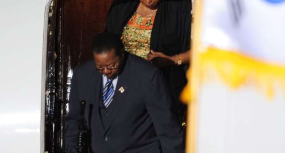 Bingu Wa Mutharika and First Lady Callista Mutharika leave the presidential aircraft in Seoul on November 9, 2010.  By Romeo Cacad AFPFile