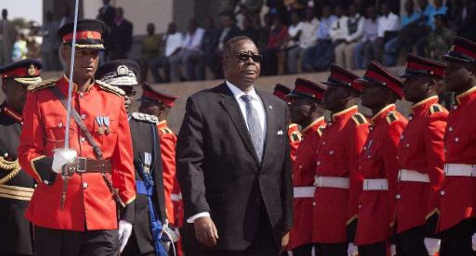 Malawis newly elected President Peter Mutharika inspects a guard of honour at the parliament building in Lilongwe before officially opening the 45th session of parliament on June 17, 2014.  By Amos Gumulira (AFP/File)