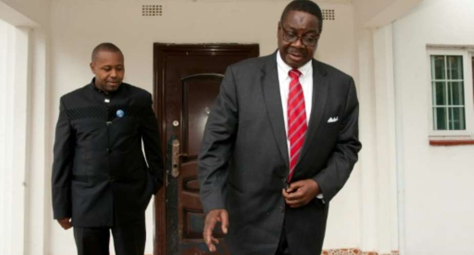 Malawi's vice president Saulos Chilima L with President Peter Mutharika R, pictured together when they were running mates in 2014.  By AMOS GUMULIRA AFPFile