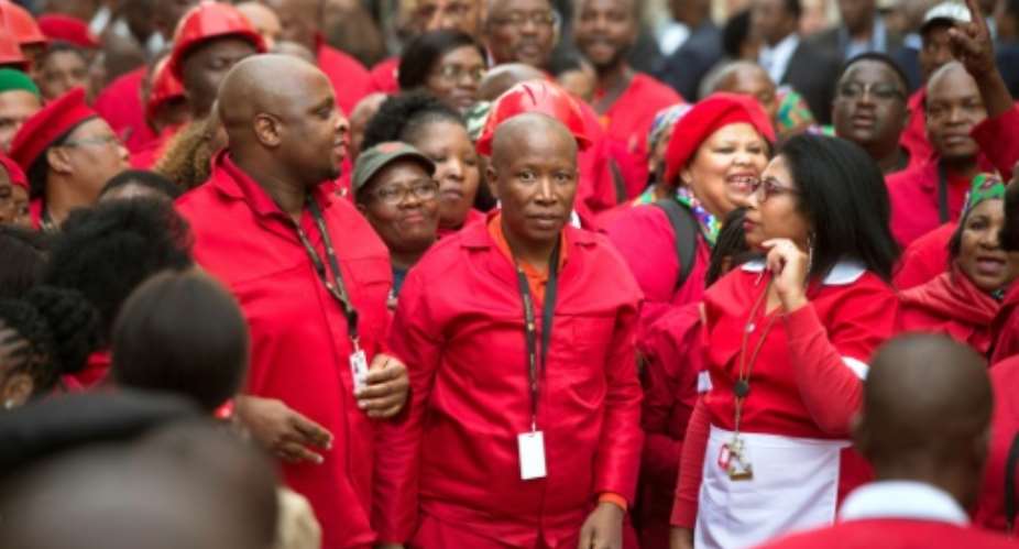 Malema, pictured last month as he arrived for the opening of the South African parliament.  By RODGER BOSCH AFP