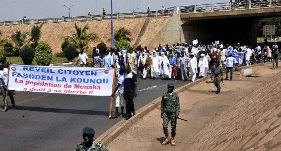 Protesters hold a banner reading Citizens awakening, the population of Menaka has the right to its freedom!! as they march on May 2, 2015 in Bamako, Mali.  By Habibou Kouyate AFPFile
