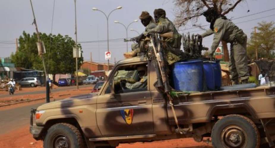 Soldiers from Chad leave Niamey for the Malian border on January 26, 2013.  By Boureima Hama AFP