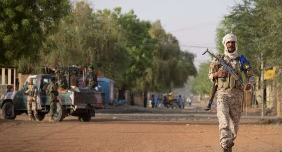A file photo shows a Malian soldier on patrol in Gao, on April 13, 2013.  By Joel Saget AFPFile