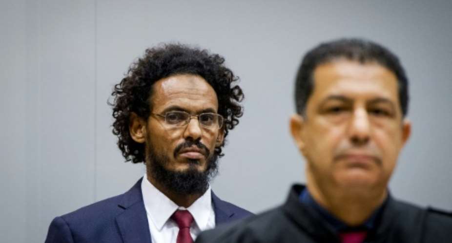 Ahmad Faqi Al Mahdi left is charged with orchestrating attacks on the Malian city of Timbuktu and the destruction of shrines at the World Heritage site in 2012.  By Robin Van Lonkhuijsen ANPAFPFile