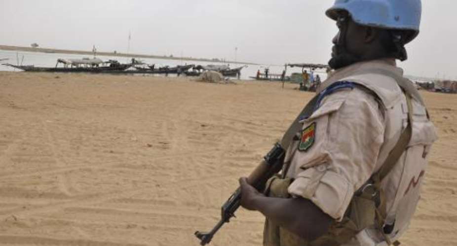 A UN peacekeeper patrols on May 12, 2015 in Timbuktu, where nine Malian soldiers were killed by the rebel Coordination of Azawad Movements the day before.  By Alou Sissoko AFPFile