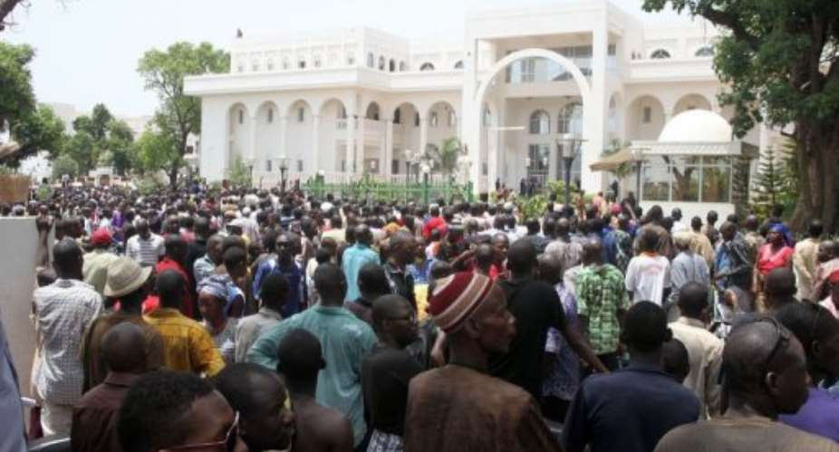Thousands of Malians gather on in front of the presidential compound in Bamako during a protest.  By Habibou Kouyate AFP