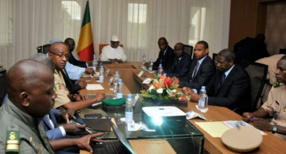 Malian President Ibrahim Boubacar Keita C attends a security meeting on July 19, 2016 at the presidential palace in Bamako, after the military camp in Nampala was attacked.  By Habibou Kouyate AFPFile