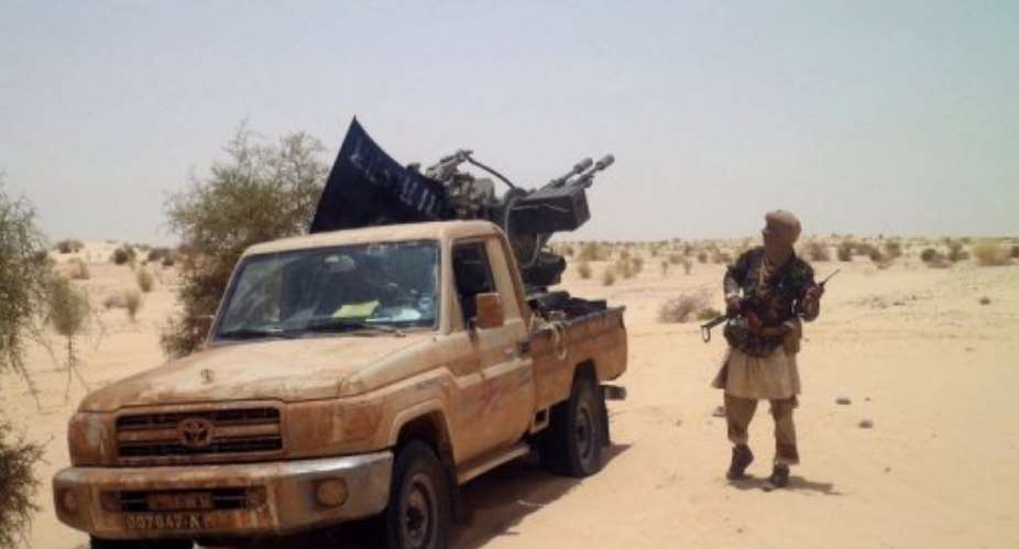 An Islamist rebel of Ansar Dine is seen near Timbuktu.  By Romaric Ollo Hien (AFP/File)