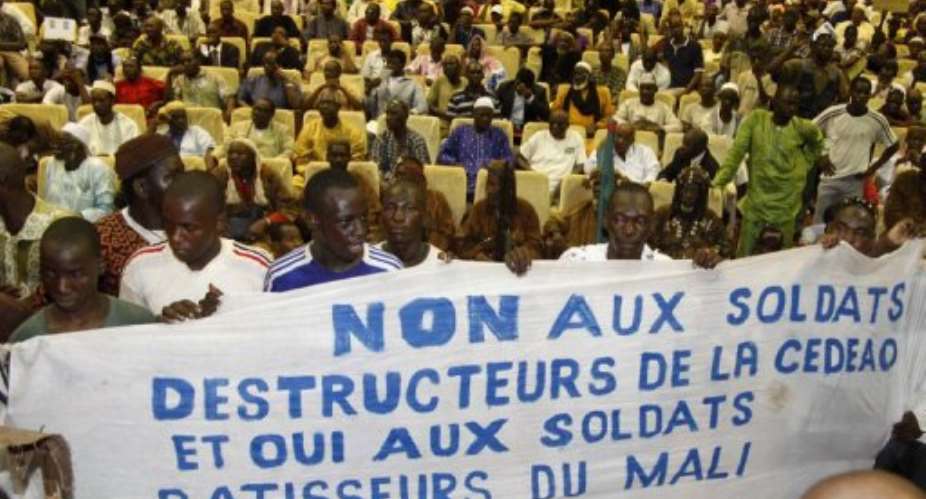 The Economic Community of West African States vowed to punish the people who attacked Malis Dioncounda Traore.  By Habibou Kouyate (AFP)
