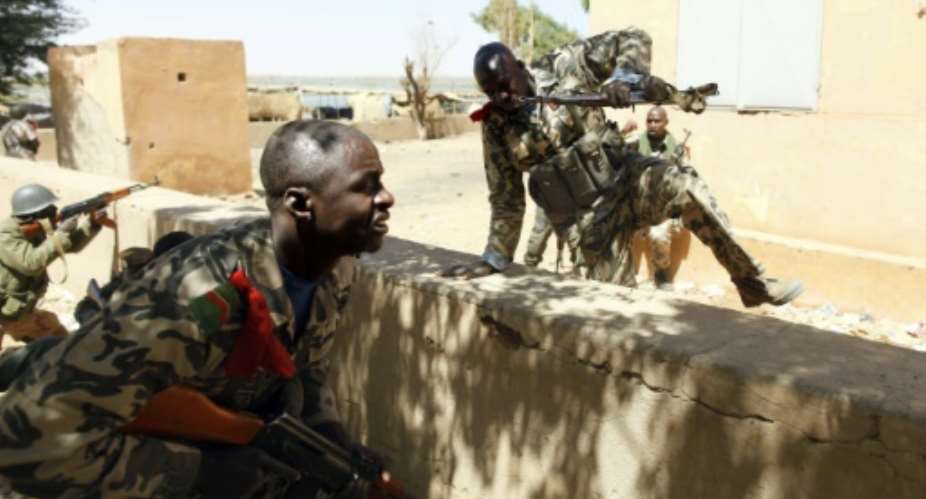 File picture shows Malian soldiers during an operation against Islamist rebels in the north of the country.  By Frederic Lafargue AFPFile