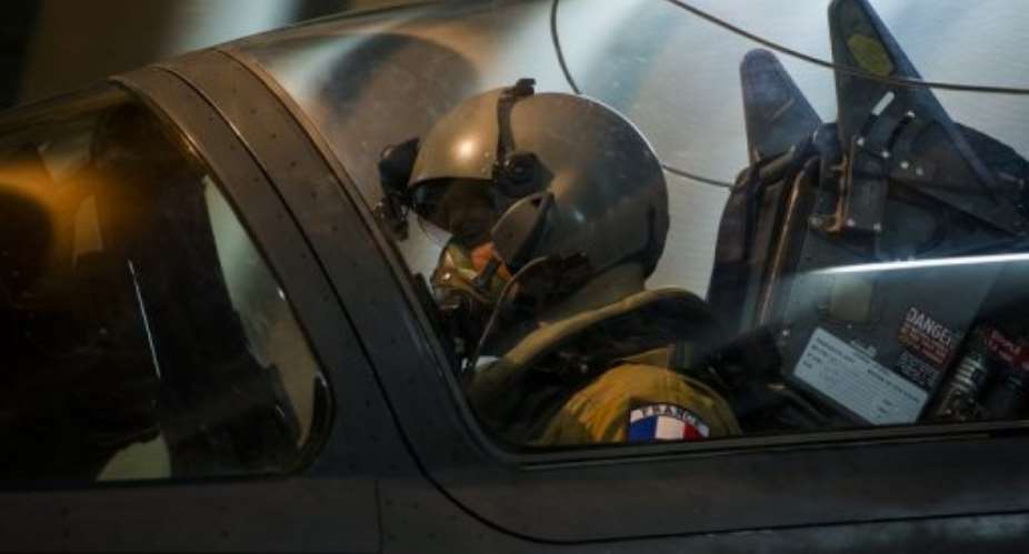 Picture released by ECPAD shows a French fighter pilot getting ready to take off from Kossei camp on January 11, 2013.  By Nicolas-Nelson Richard (ECPAD/AFP)
