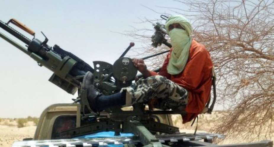 An Islamist rebel mans a gun near Timbuktu.  By Romaric Ollo Hien AFPFile