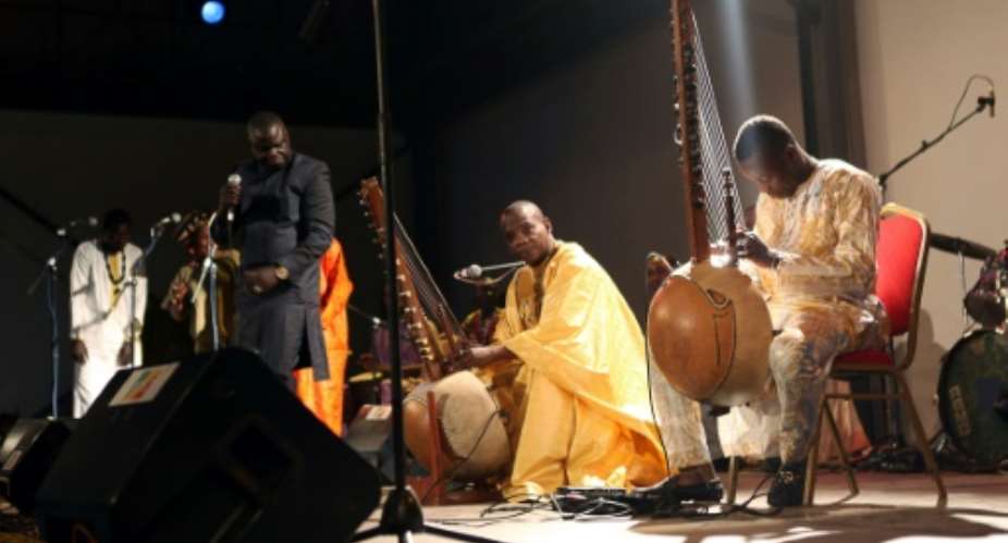 Malian kora players with an instrument similar the one played by Sissoko.  By SBASTIEN RIEUSSEC AFP