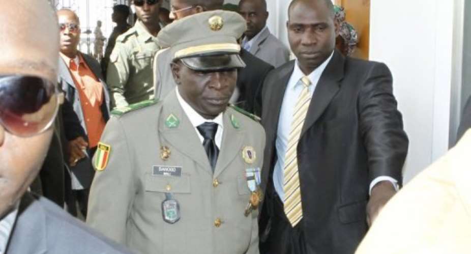 Malian captain Amadou Sanogo (C) arrives for an official investiture ceremony in Koulouba on February 13, 2013.  By  (AFP/File)