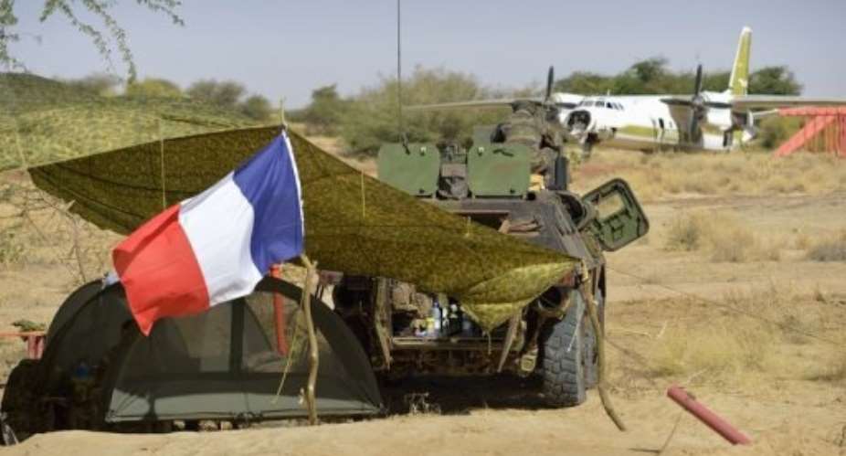 A French flag flies at a military camp on January 30, 2013 set up at Timbuktu airport.  By Eric Feferberg AFP