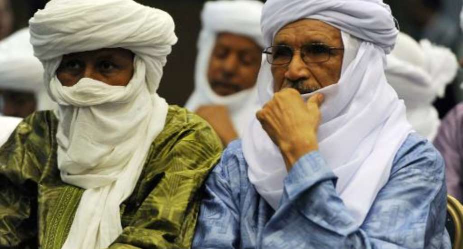 Malian Tuareg leaders attend a signing ceremony for a peace agreement in Algiers on May 14, 2015.  By Farouk Batiche AFPFile