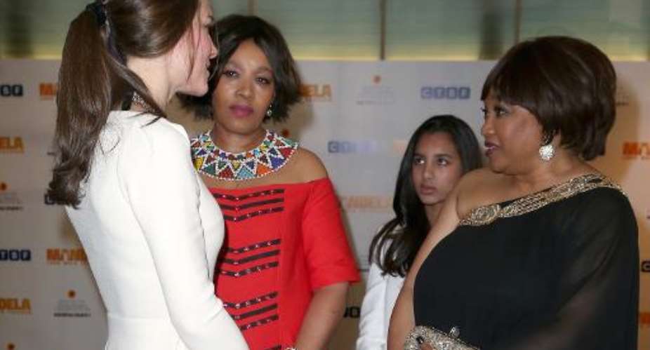 The Duchess of Cambridge speaks with Zindzi Mandela, daughter of South African leader Nelson Mandela, before the royal film premier of Mandela: Long Walk to Freedom in  London on December 5, 2013.  By Chris Jackson AFP