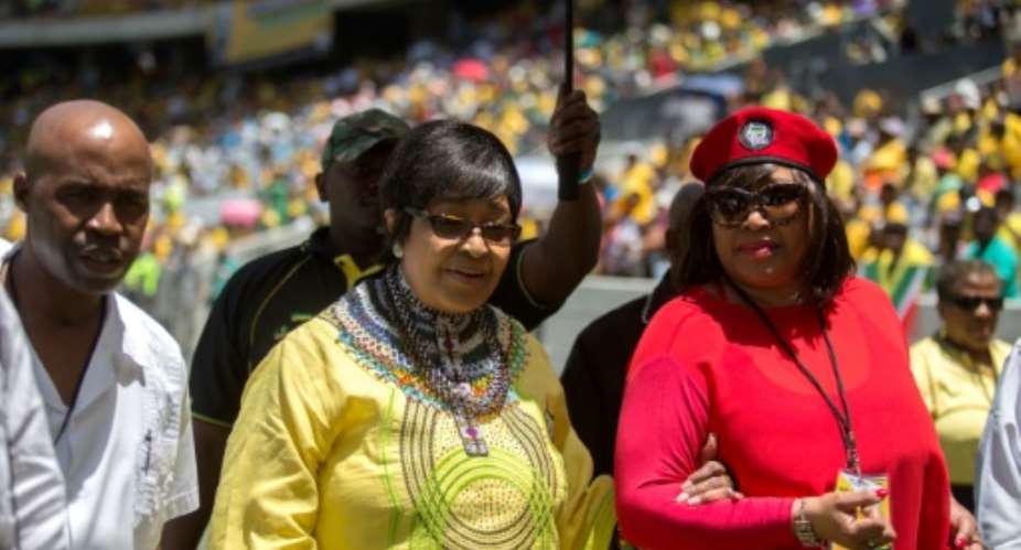 Winnie Madikizela-Mandela (C), ex-wife of Nelson Mandela, arrives for the 103rd birthday celebrations of South Africas ruling African National Congress (ANC) party in Cape Town on January 10, 2015.  By Jennifer Bruce (AFP/File)
