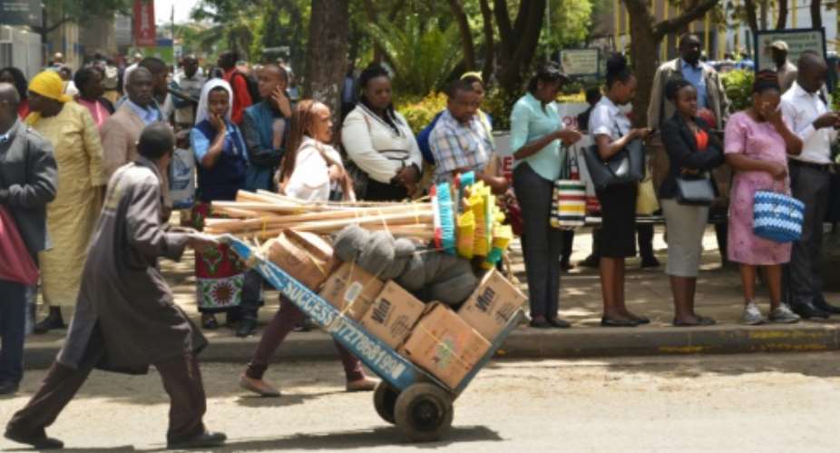 Many commuters were stranded at bus stops as police kicked off the safety crackdown.  By SIMON MAINA AFP