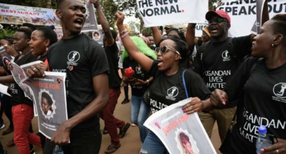 Marchers in Uganda wore T-shirts declaring Women's Lives Matter and held posters listing the names of murdered women.  By Isaac Kasamani AFP