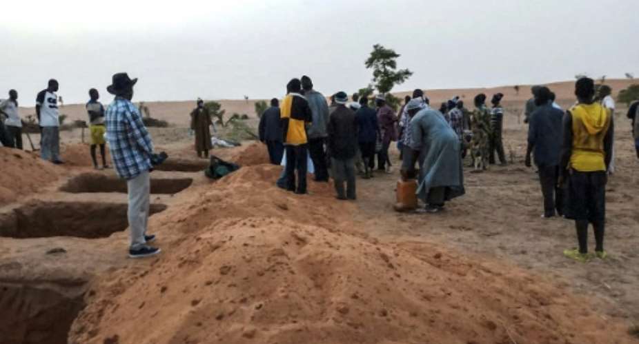 Mass graves were dug for victims of Sunday's attack, the latest episode of bloodshed in central Mali.  By STRINGER AFP