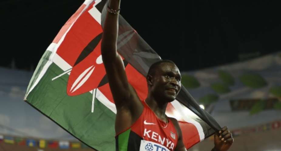 Kenya's David Rudisha celebrates winning the final of the men's 800 metres at the world championships in Beijing on August 25, 2015.  By Olivier Morin AFP