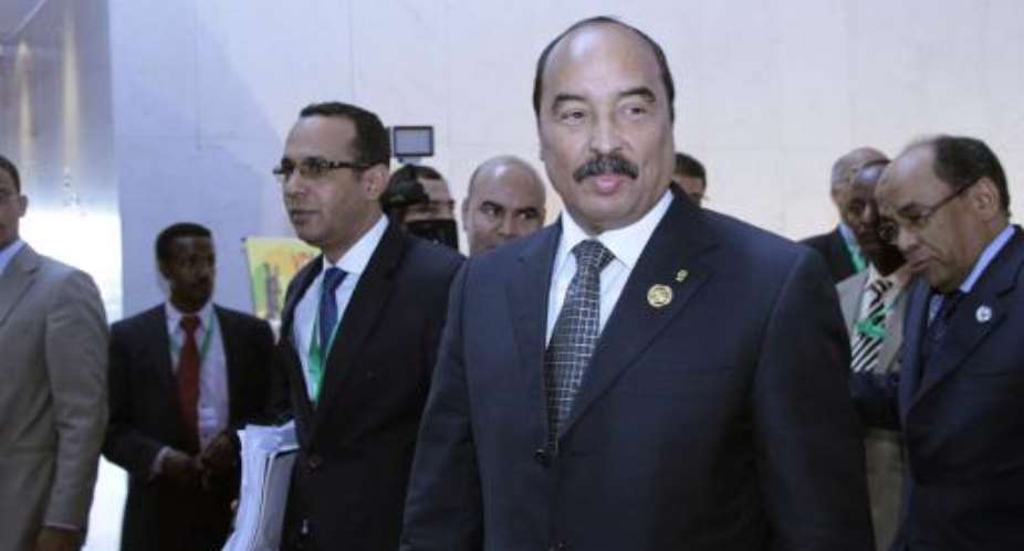 Mauritanian President Mohamed Ould Abdel Aziz 2nd R walks with African Union AU delegates at the 22nd AU summit in Addis Ababa on January 31, 2014.  By Solan Gemechu AFPFile