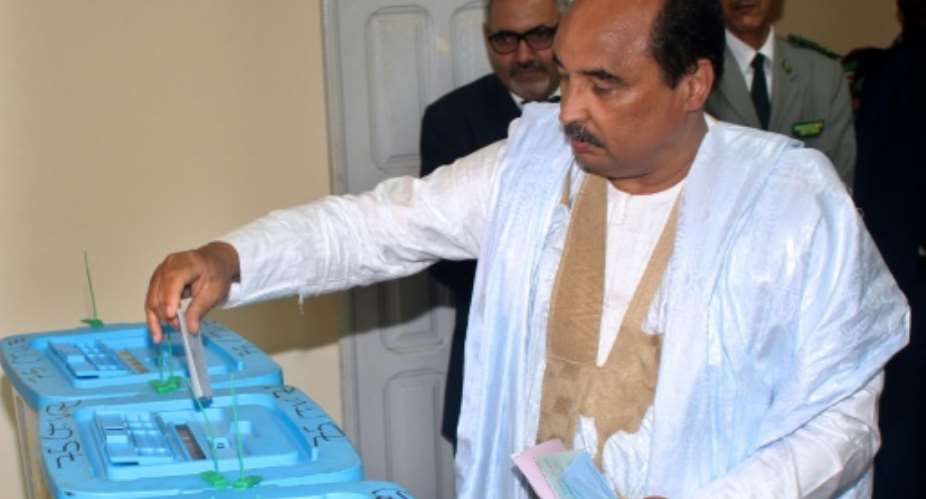 Mauritanian President Mohamed Ould Abdel Aziz casts his vote on September 1 at a polling station in Nouakchott, during the country's legislative, regional and local elections.  By AHMED OULD MOHAMED OULD ELHADJ AFP