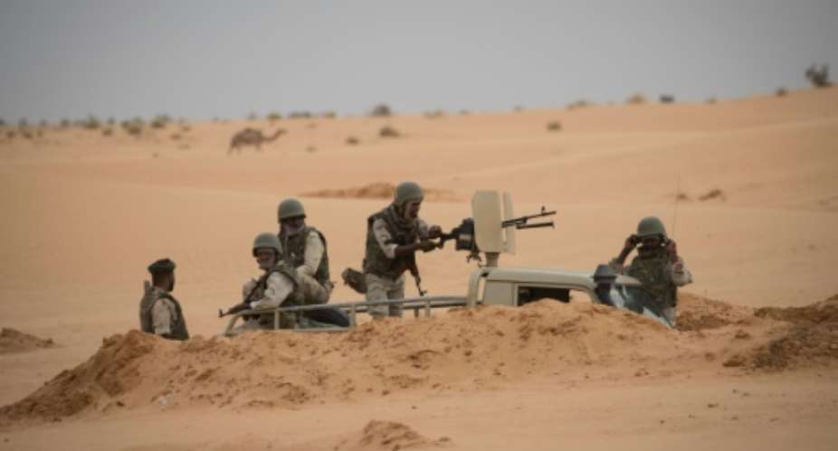 Mauritanian soldiers stood guard at a G5 Sahel task force command post in southeast Mauritania.  By THOMAS SAMSON AFP