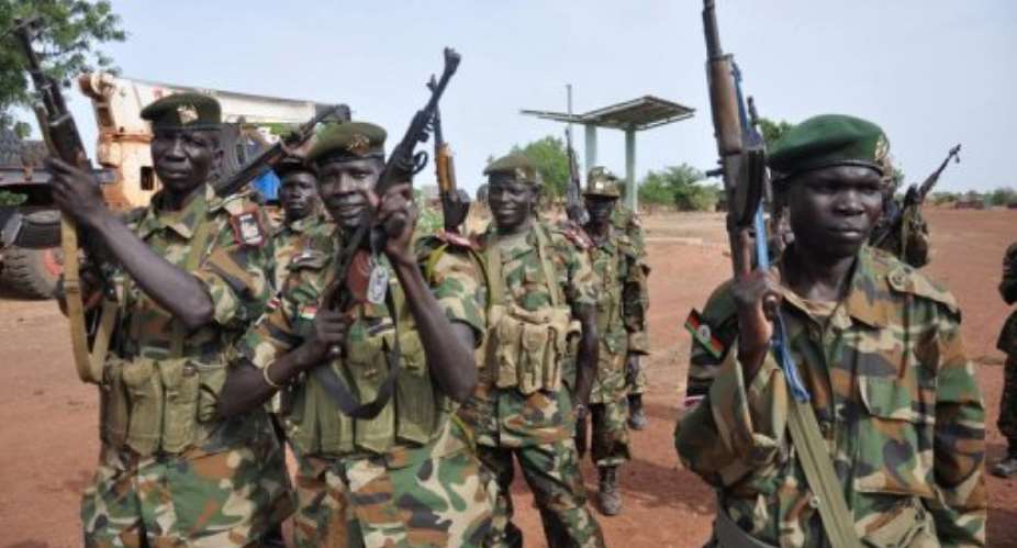Sudanese Peoples Liberation Army soldiers pose at a base near Bentiu.  By Hannah Mcneish (AFP/File)