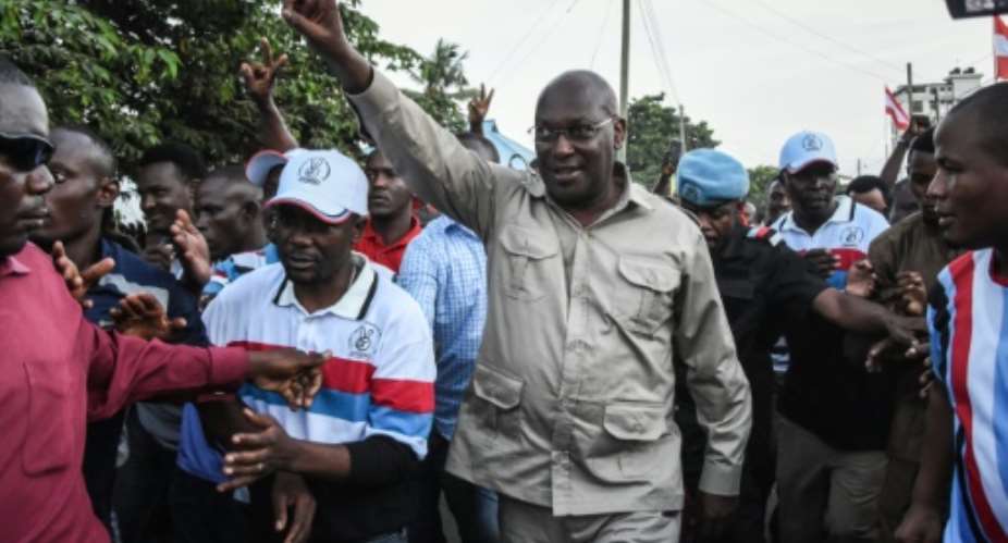 Mbowe, waving, was detained with 15 other party members in a late-night crackdown last week.  By Ericky BONIPHACE AFPFile