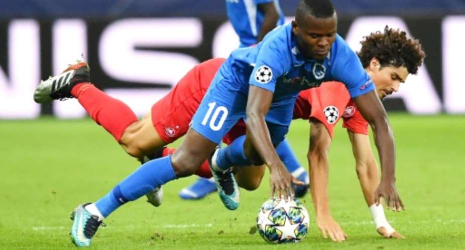 Mbwana Samatta, in the blue of Genk, scraps for possession in the Belgian side's defeat against Salzburg with which they began their Champions League campaign.  By JOE KLAMAR AFPFile