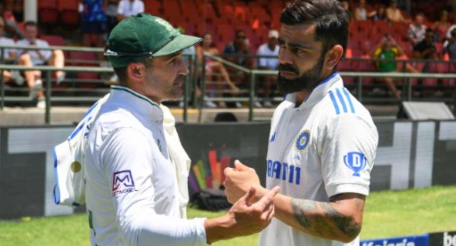 Meeting of minds: South Africa's Dean Elgar left and India's Virat Kohli talk after the end of the second Test.  By Rodger Bosch AFP