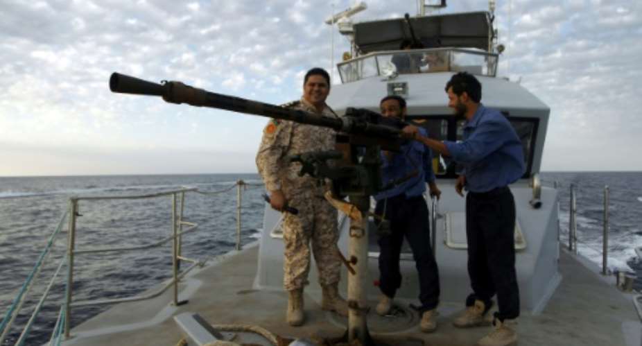 Members of Libyan naval forces patrol the sea off the coast of Libya's second city Benghazi on November 20, 2016.  By Abdullah DOMA AFPFile