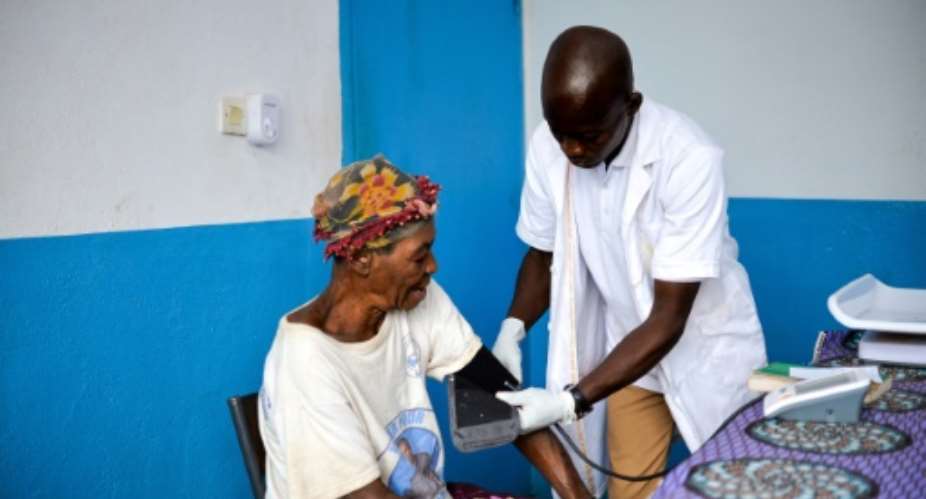 Members of the Aka, a Pygmy community in a remote corner of the Central African Republic, now have access to modern medicine for the first time.  By Barbara DEBOUT (AFP)