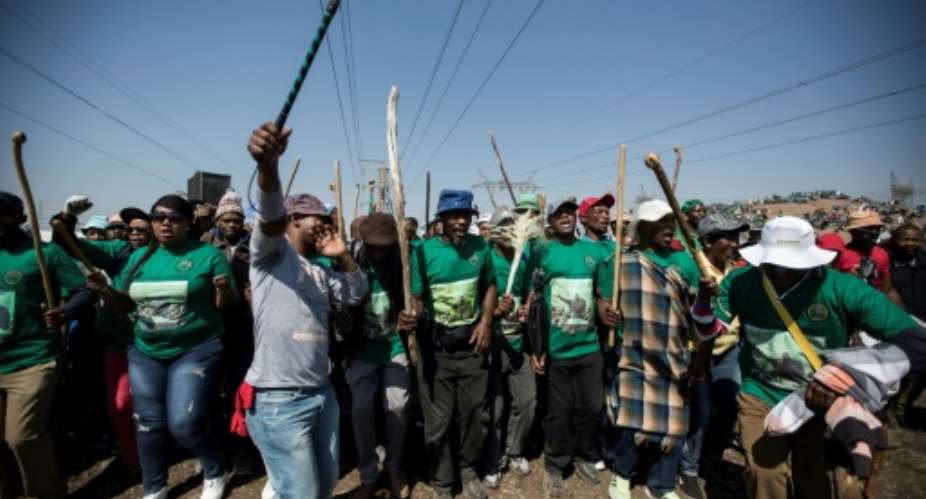 Members of the Association of Mineworkers and the Marikana community mark the fifth anniversary of the Marikana massacre on August 16, 2017.  By GULSHAN KHAN AFP