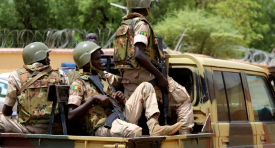 Members of the Mali Armed Forces FAMA patrol in the streets of Gao, in central Mali, in July 2019.  By Souleymane Ag Anara AFPFile