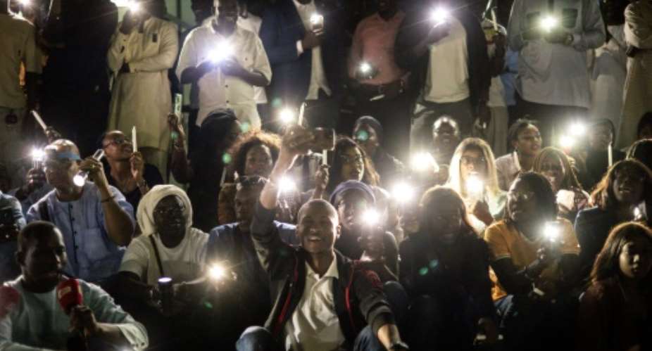 Members of the Senegalese media at a vigil to protest against police violence.  By JOHN WESSELS AFPFile