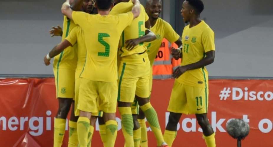 Members of the South African national football team celebrates a goal during the 2019 African Cup of Nations qualifyer football match against Nigeria at Goodswill Akpabio International Stadium on June 10, 2017.  By PIUS UTOMI EKPEI AFP