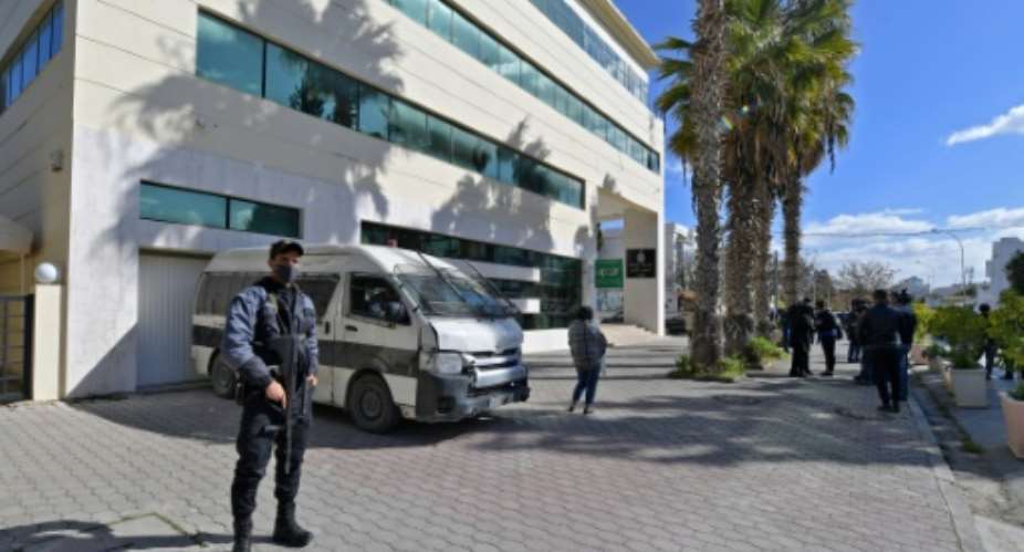 Members of the Tunisian security forces stand outside the closed headquarters of Tunisias Supreme Judicial Council (CSM) in the capital Tunis on February 7, 2022.  By FETHI BELAID (AFP)