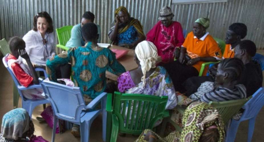 Members of the UN Human Rights Office meet with displaced civilians at a community centre on November 28, 2016, in Juba, South Sudan.  By Albert Gonzalez Farran AFPFile