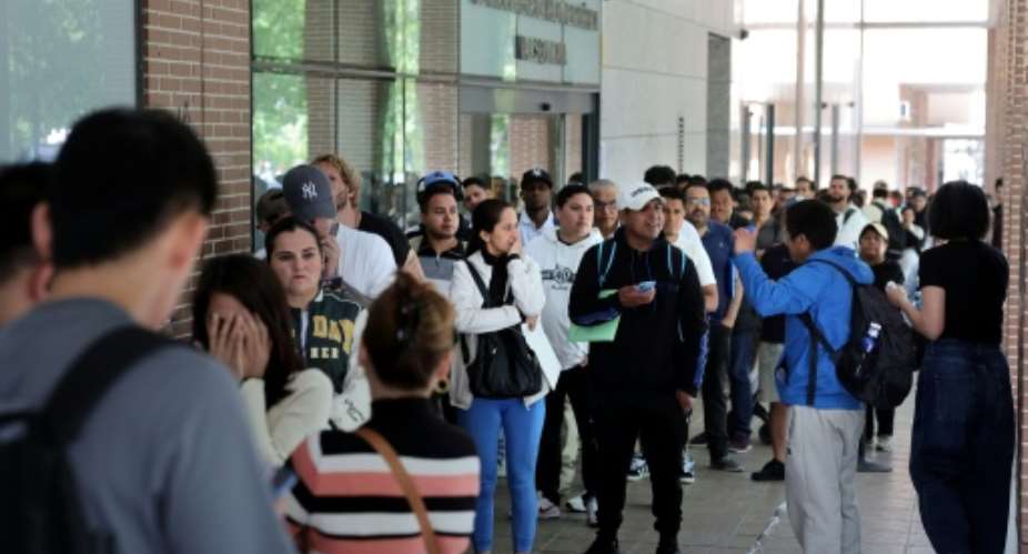 Men, women and children have queued in the streets to obtain documents and attend appointments for their regularisation.  By Thomas COEX (AFP)